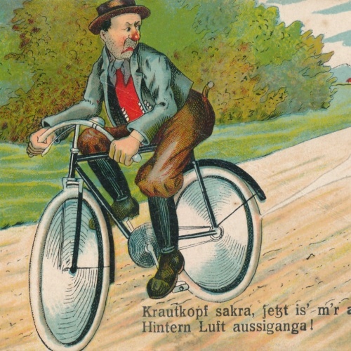 AK Radfahrer Krautkopf sakra jetzt is m´r am Hintern Luft Ansichtskarte (15746)